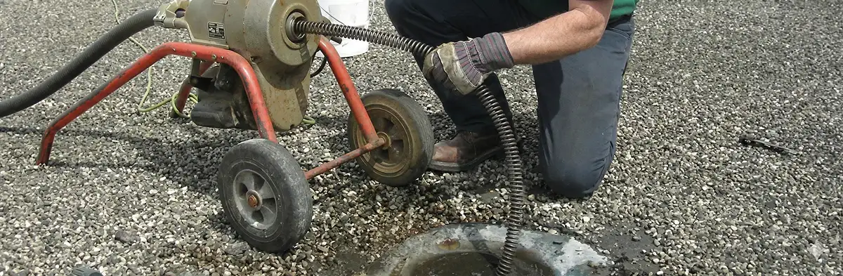 sewer rodding technician actively removing blockages from a sewer line in Clearwater, FL
