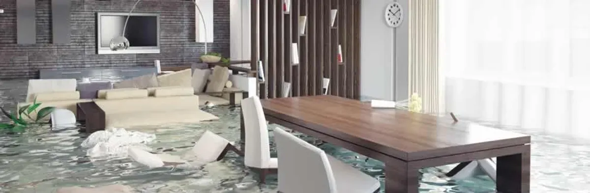 home interior affected by water damage with flooded floors and displaced furniture in Clearwater, FL