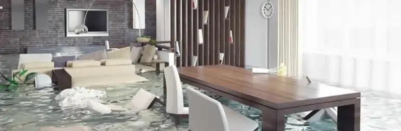 home interior affected by water damage with flooded floors and displaced furniture in Clearwater, FL